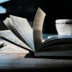 open book on brown wooden table